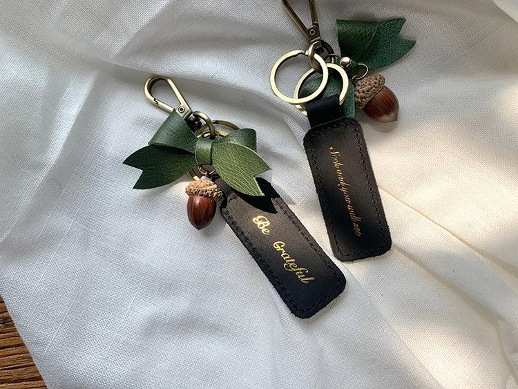 {Gentle Beacon}Always be happy and grateful for everything. Handmade cowhide keychain pendant green gold-stamped bow